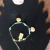 Bracelet de cheville perles bleu/vert et coquillage